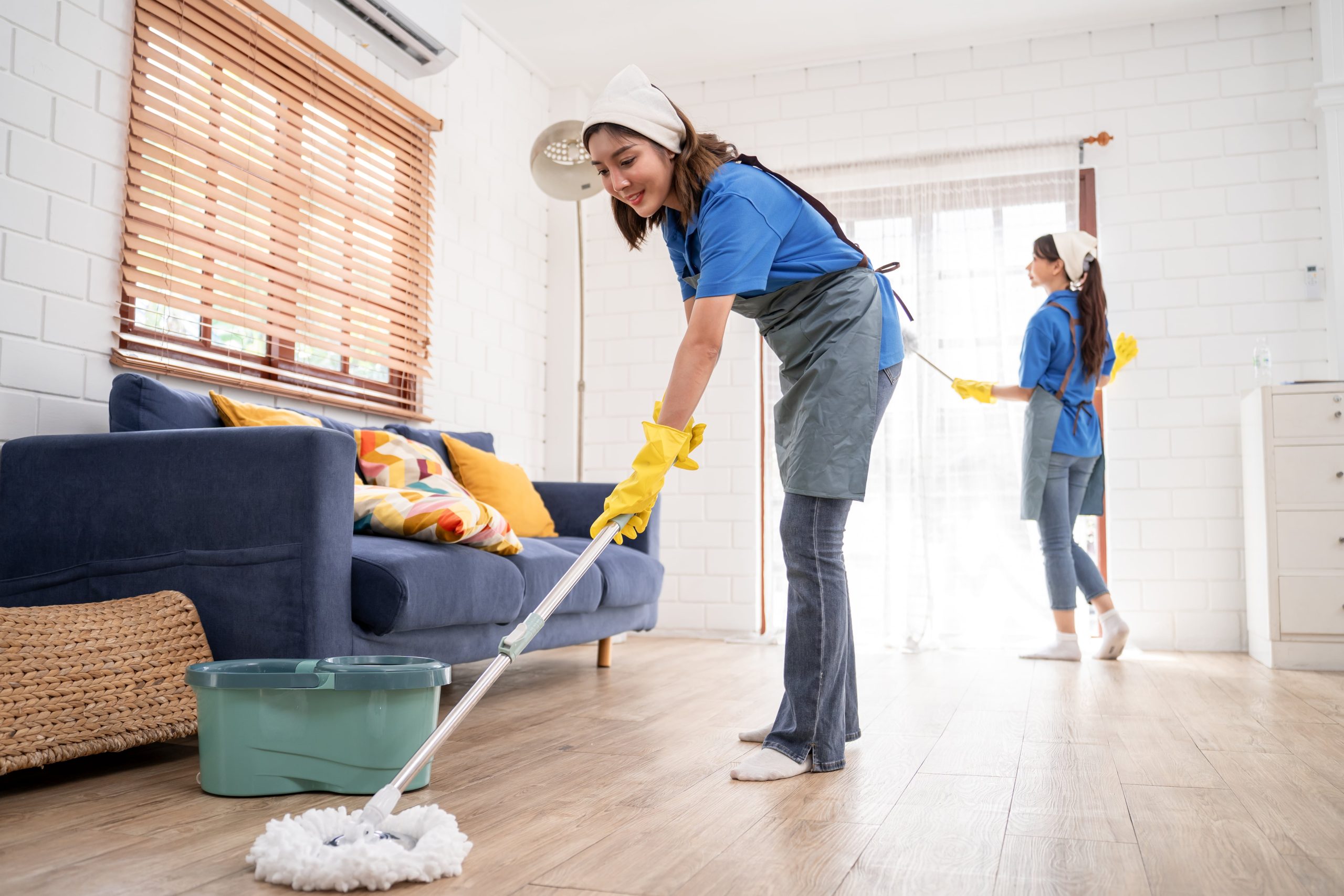 asian-young-woman-cleaner-team-cleaning-indoors